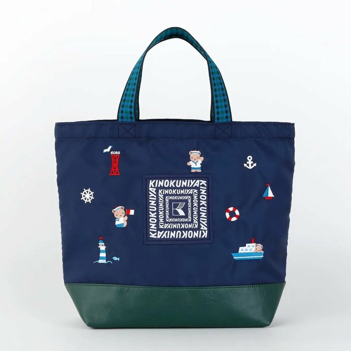 オリジナルカラーで施された紀ノ国屋のロゴが織りネームで再現