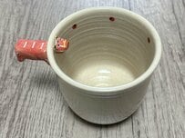 福島県で購入した「赤べこが突き刺さったコップ」　面白かわいいデザインに笑ってしまう