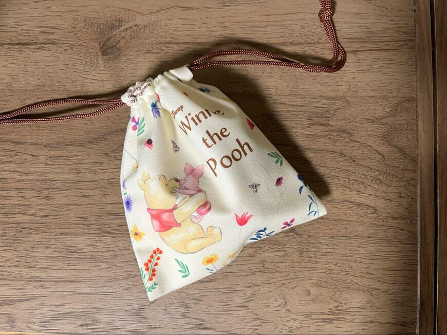 ダイソー、ふんわり生地巾着(くまのプーさん)画像