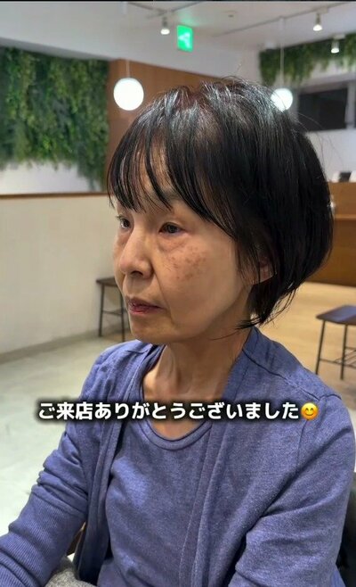 前髪があり、丸みのあるシルエットに整った黒髪のショートボブ
