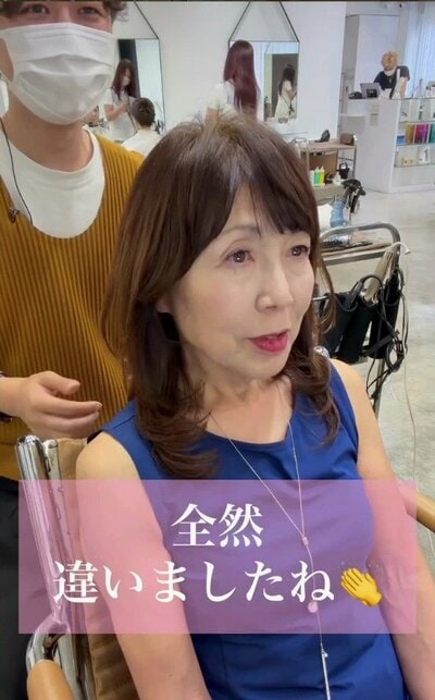 前髪があり、毛先に動きのあるレイヤースタイル